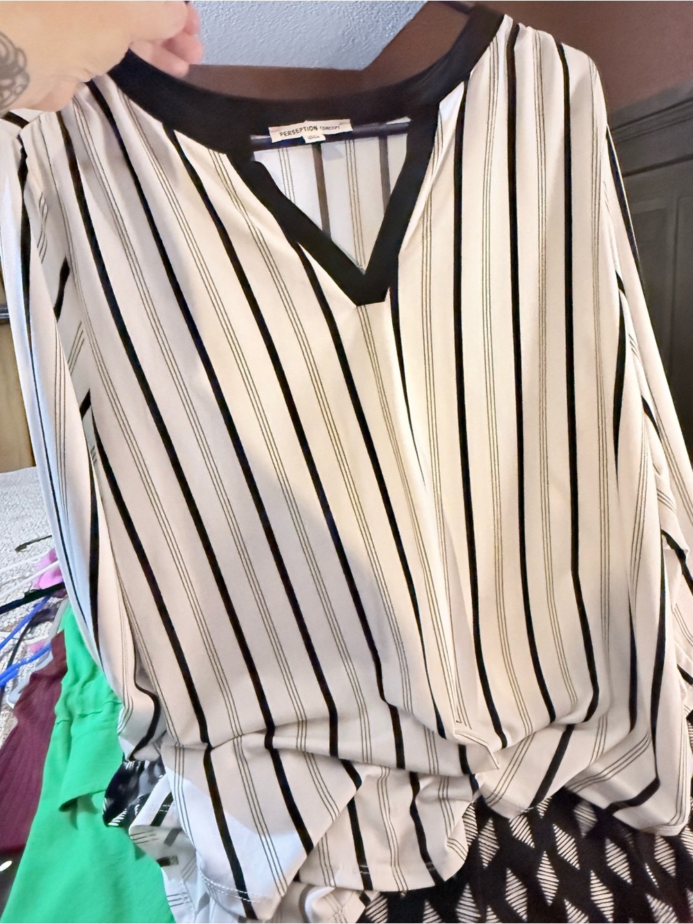 Black and white striped blouse.